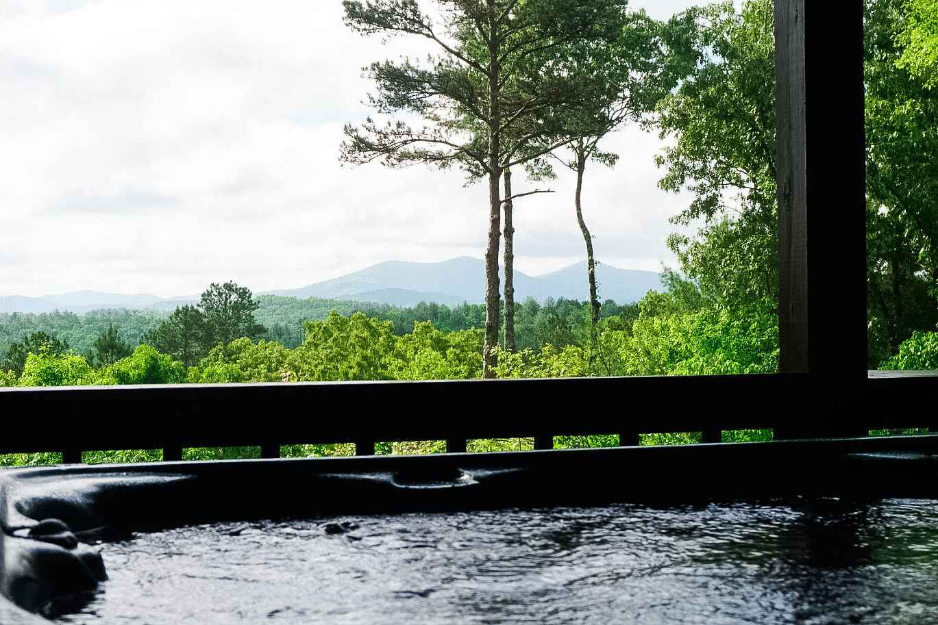 Relax in the hot tub with breathtaking mountain views at our cozy Blue Ridge cabin. The perfect North Georgia mountain escape.