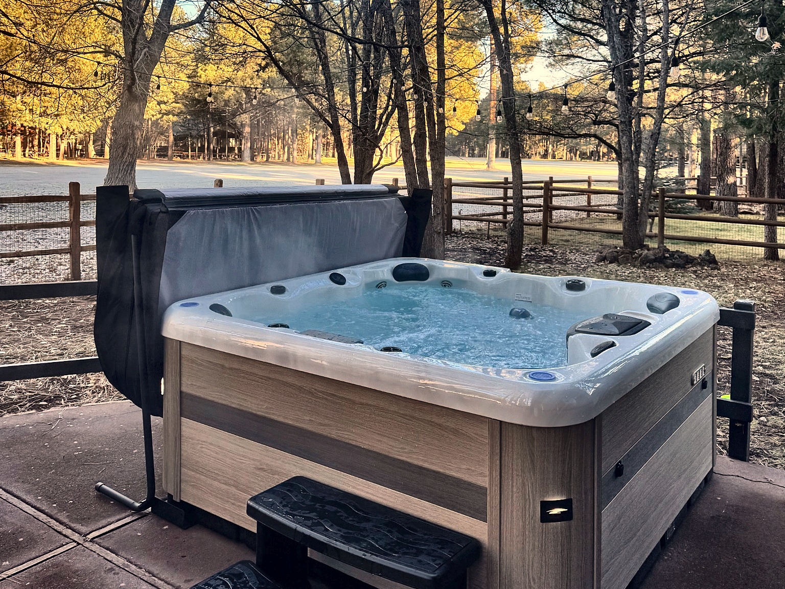 Private hot tub in the pines — perfect for a steamy soak