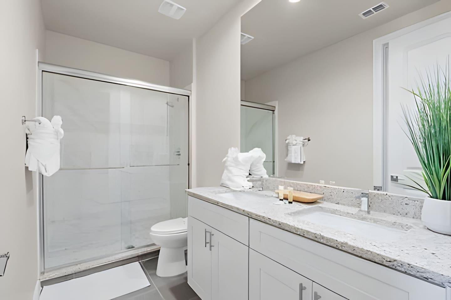 Enjoy the spacious bathroom, complete with sleek, modern fixtures.