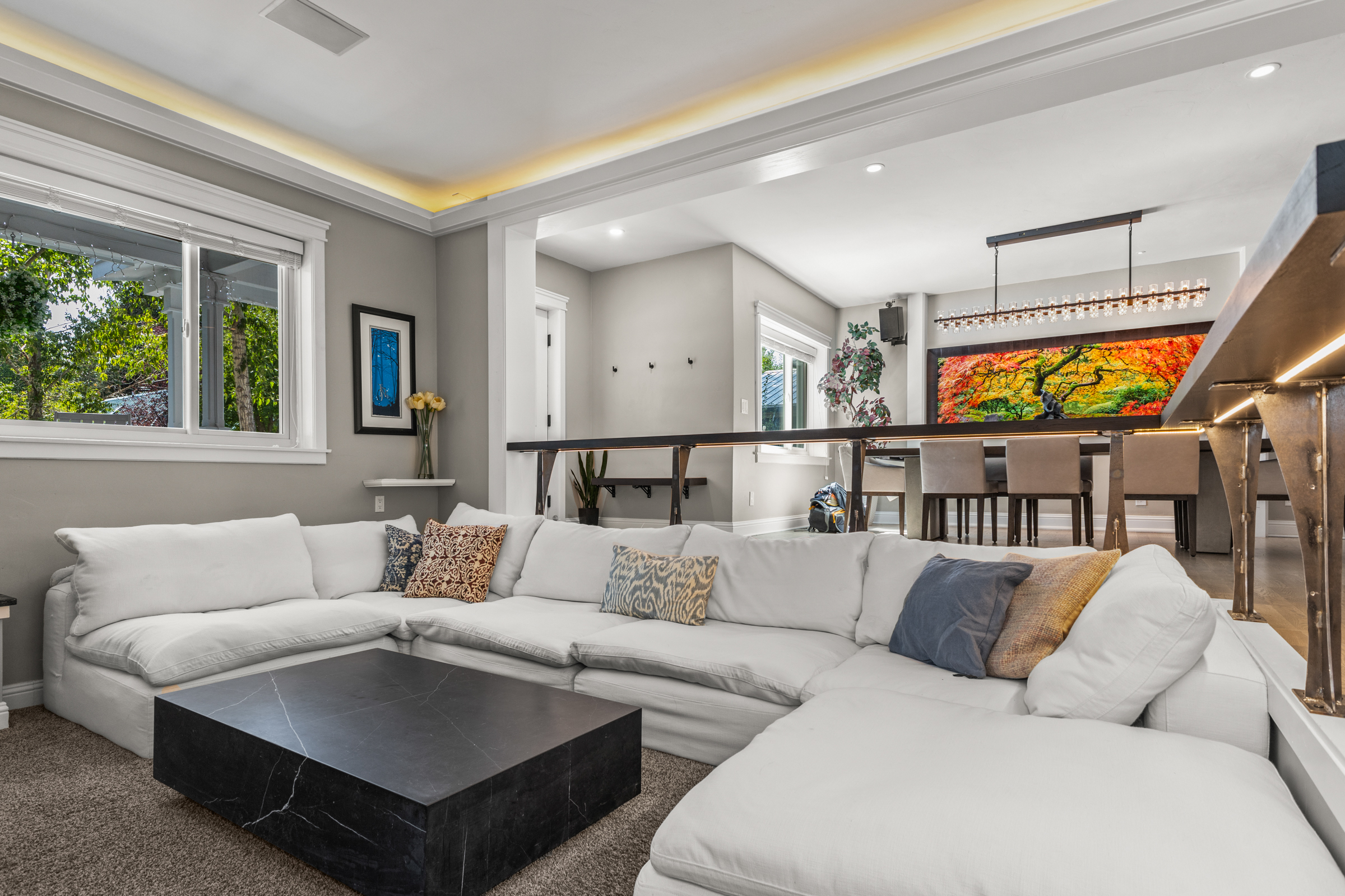 View of Living Area into Front Entrance and Dining Area
