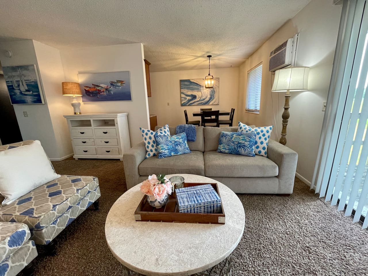 Coastal charm meets comfort in this inviting living and dining space, featuring beachy blue accents, plush seating, and a bright, airy vibe. Enjoy meals at the dining table or unwind in the lounge area—perfect for relaxing after a day of exploring.