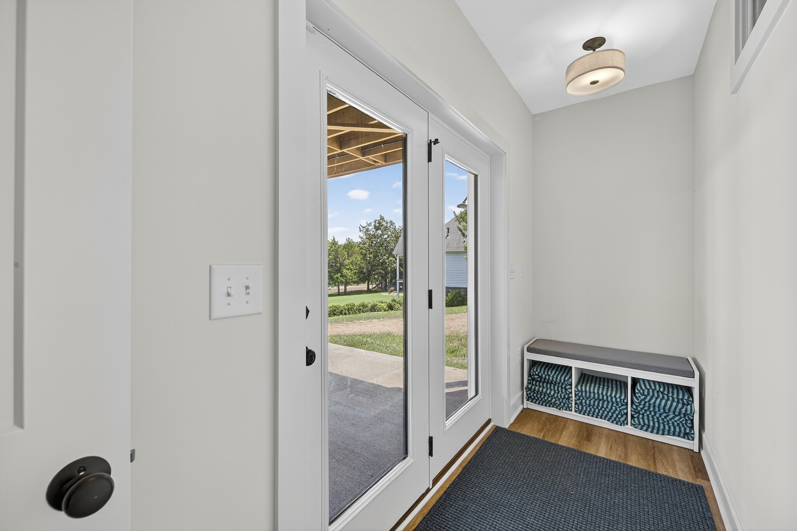 Convenient lakeside entry with bench seating and cubbies—perfect for dropping towels, shoes, and lake gear.