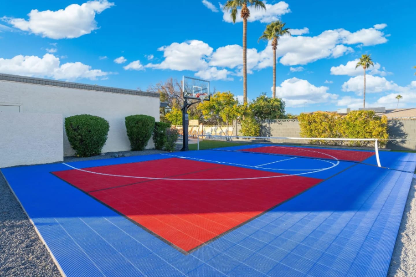 A full-size hoop and painted court lines mean pickup games are always on the table.
