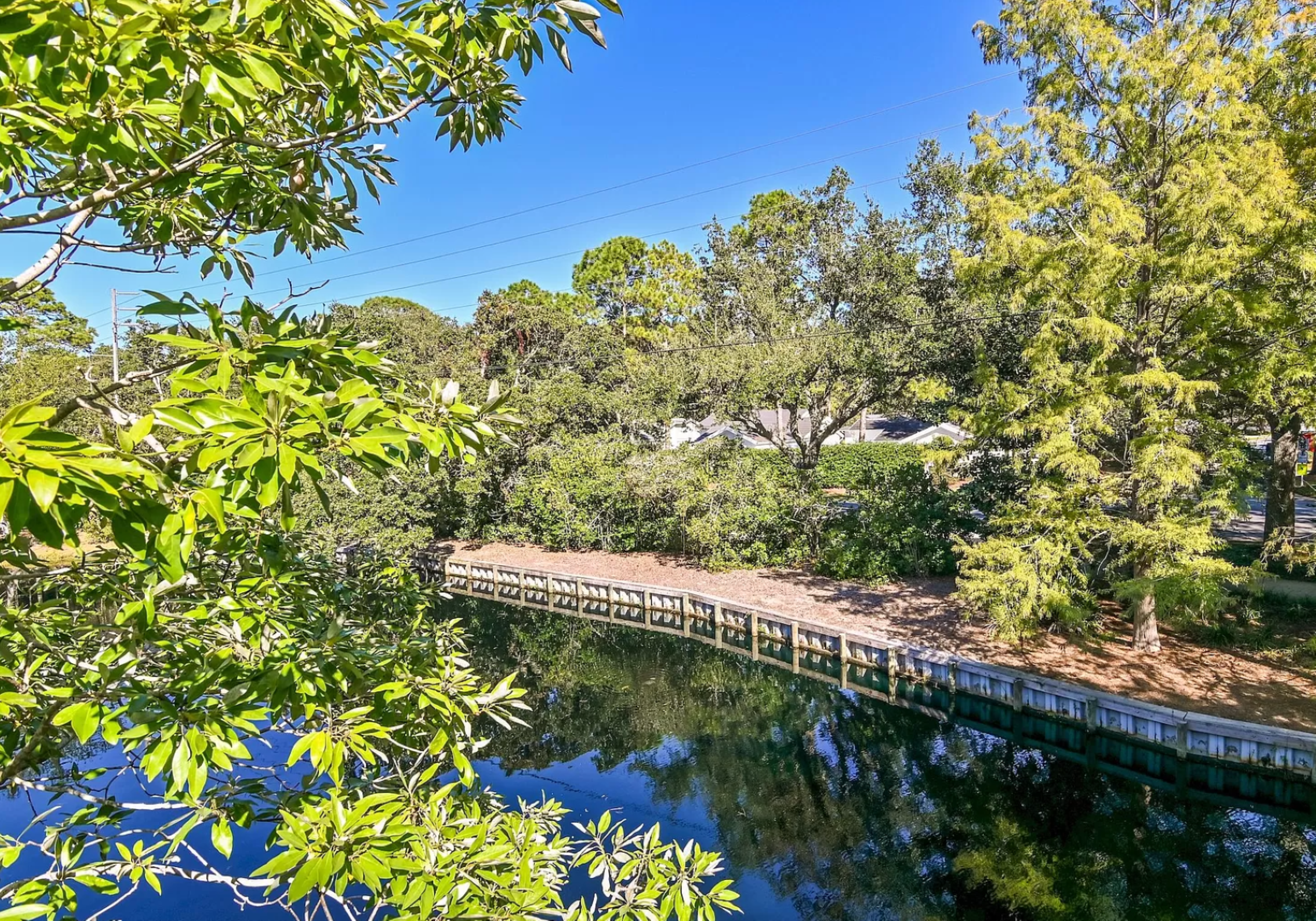 One of the beautiful views of the Sandestin Resort. Marked by beautiful vegetation and a winding canal bordered by a wooden walkway.