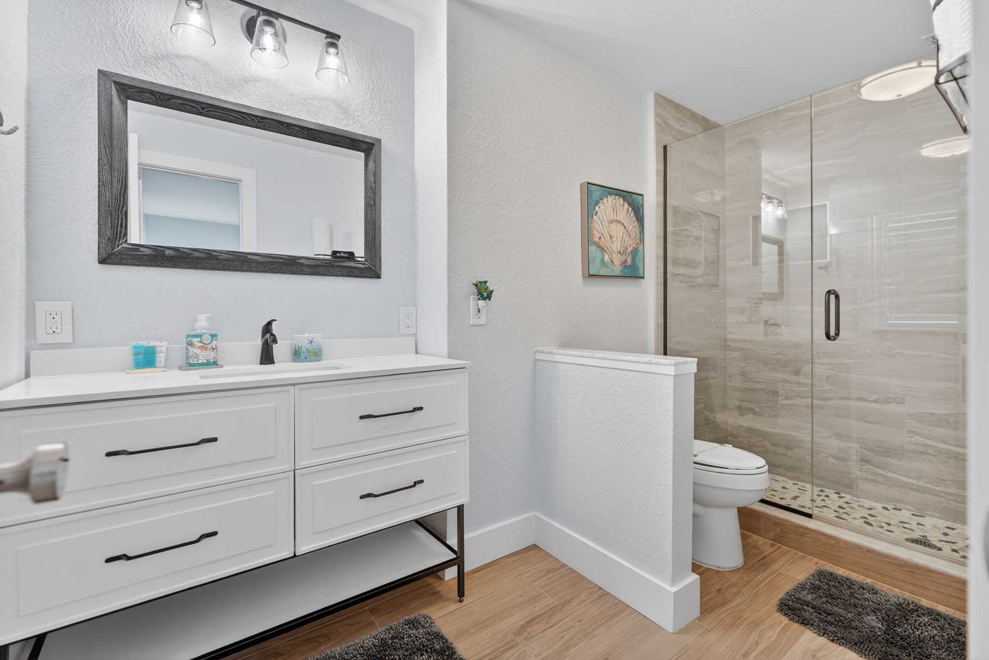 Bathroom with vanity and mirror