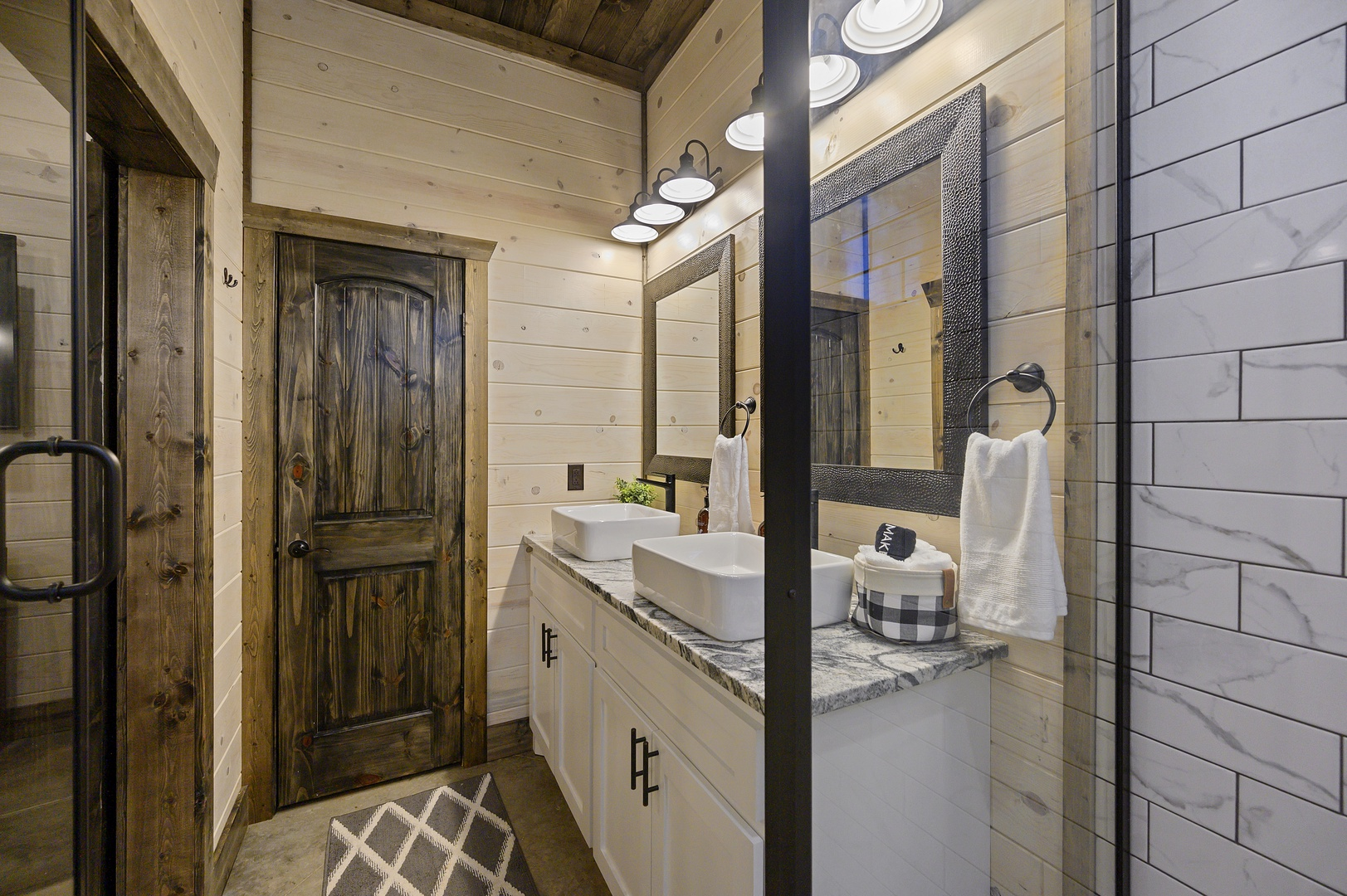 bath with simple lines and natural textures. Towels are fluffy, counters are clear, and everything feels effortless.