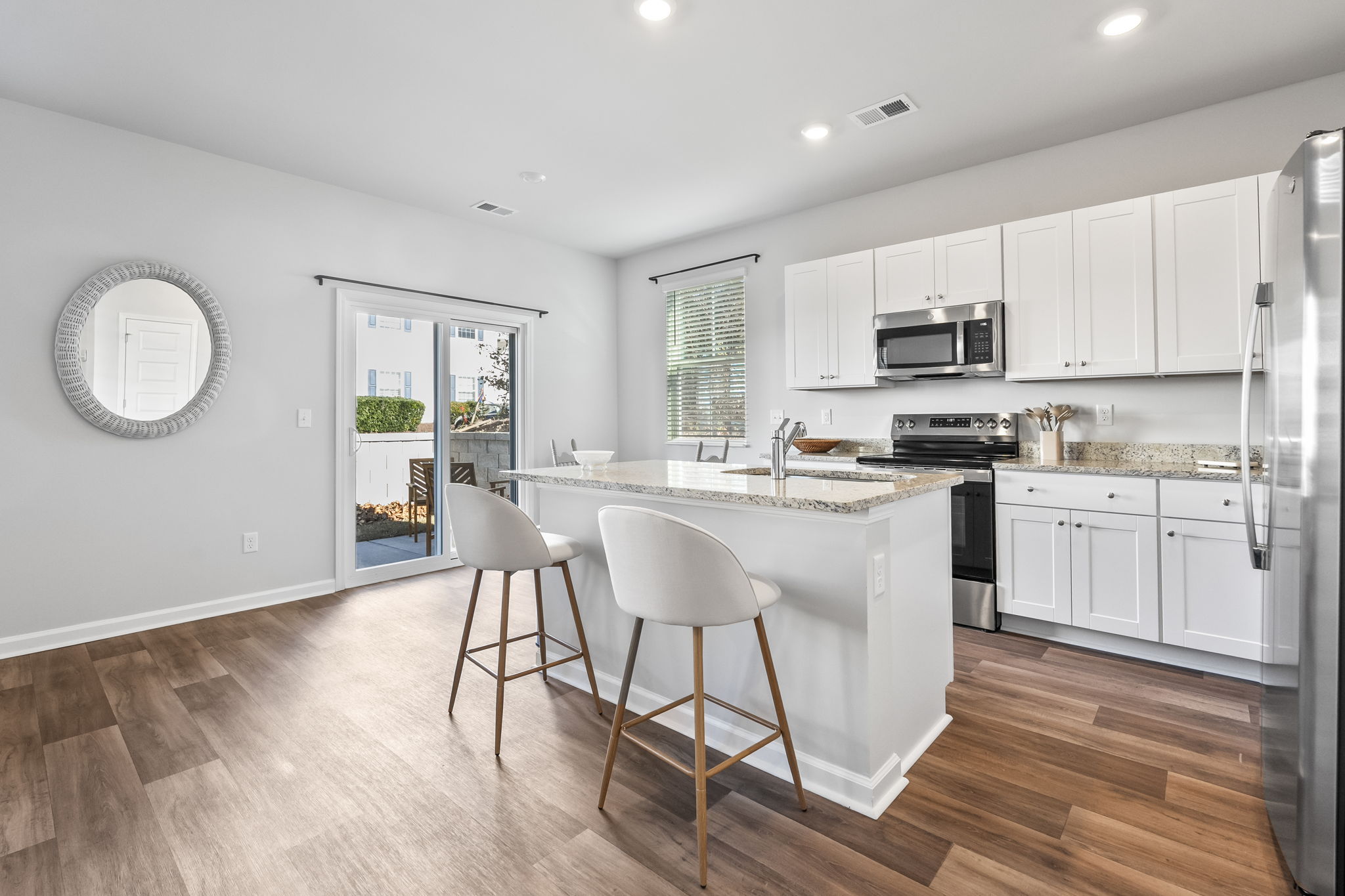 Modern kitchen with granite countertops and stainless steel appliances