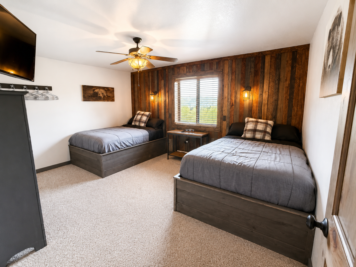 Spacious multi bed bedroom gives families and groups flexible sleeping accommodations with plenty of room to settle in and recharge between Northwoods adventures.