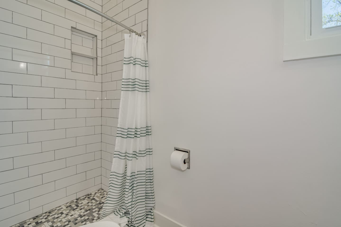 Modern bathroom with bright vanity and clean design.