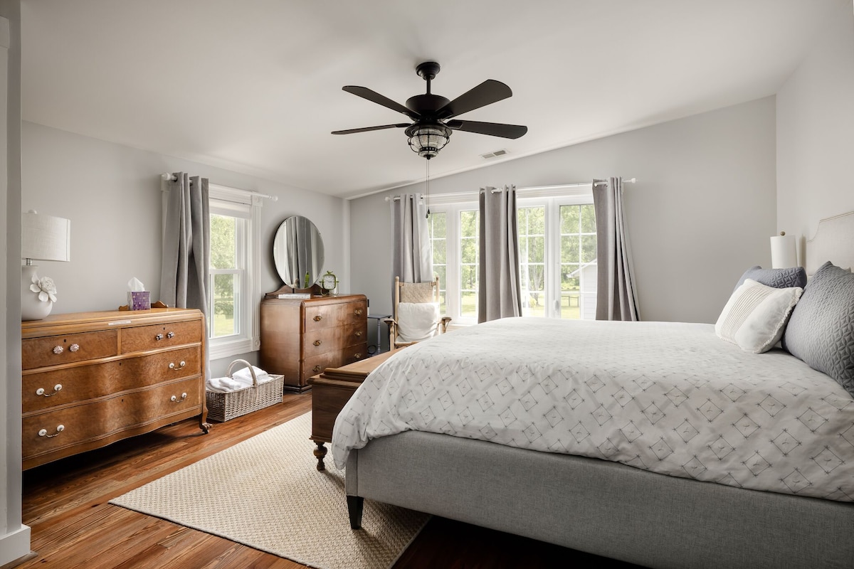 Master bedroom with King bed, tempurpedic mattress, antique art nouveau dressers