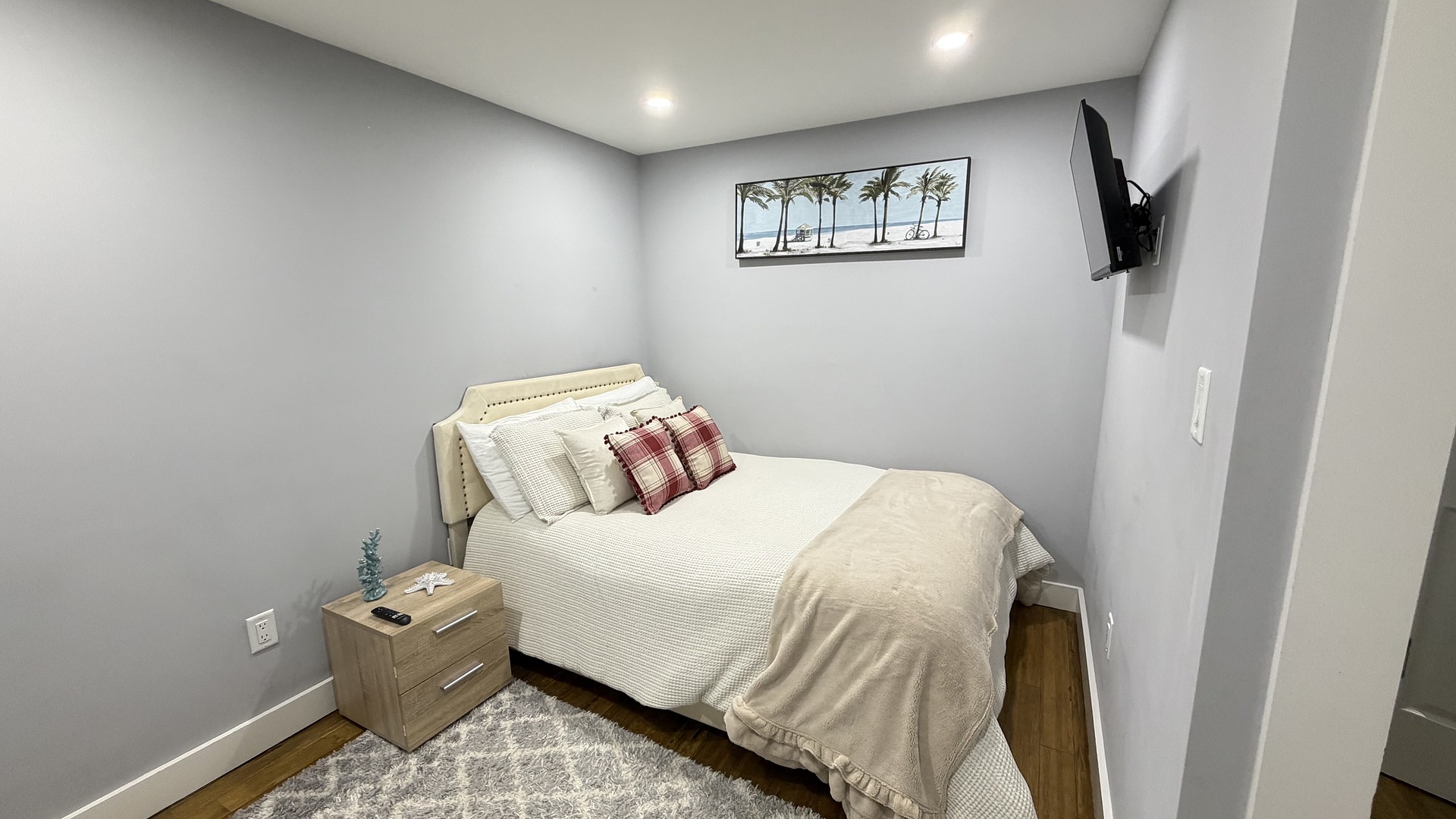 Bedroom 5 (basement) with queen bed and smart TV