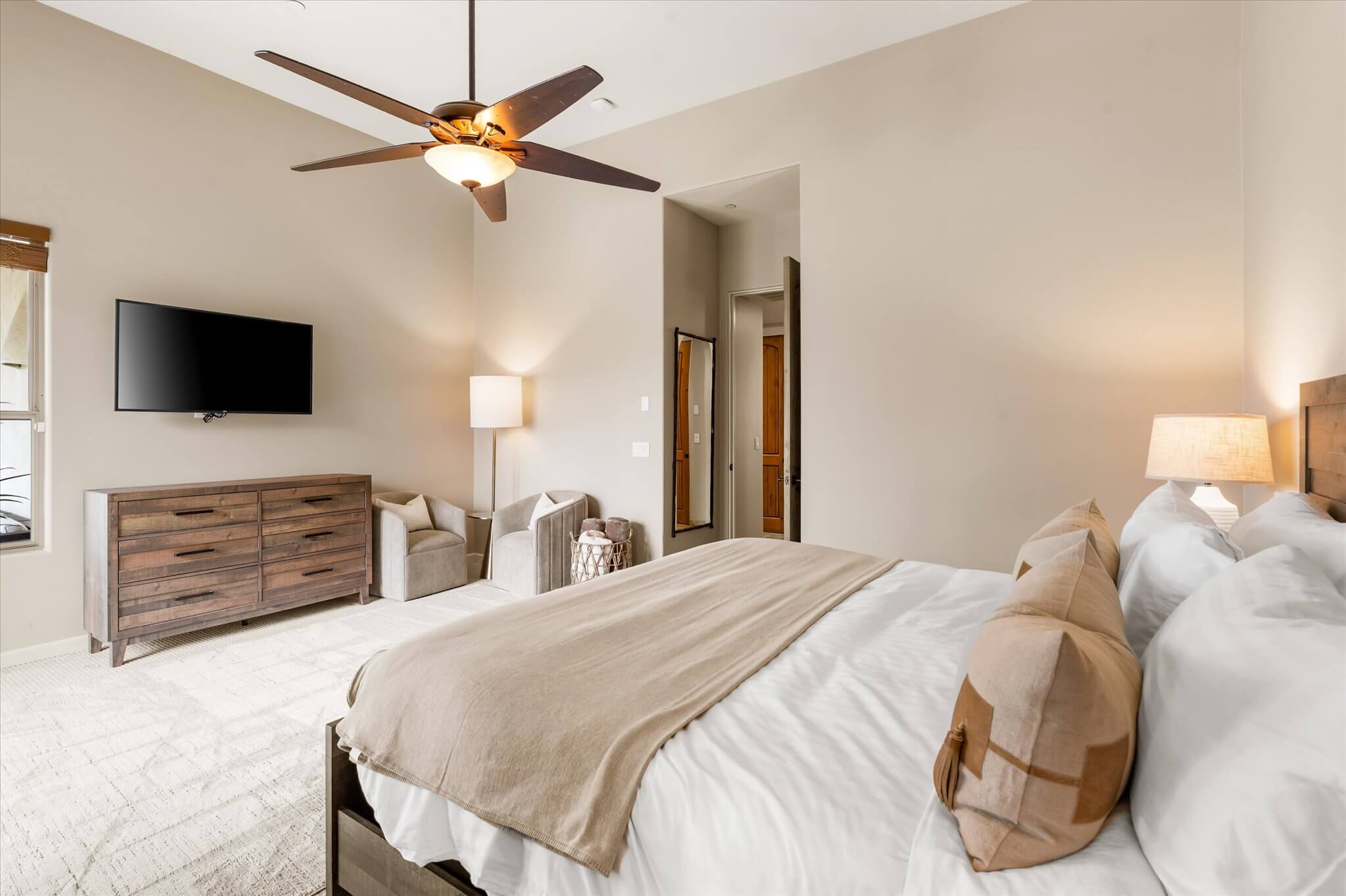 King bed with view of TV and Seating Area