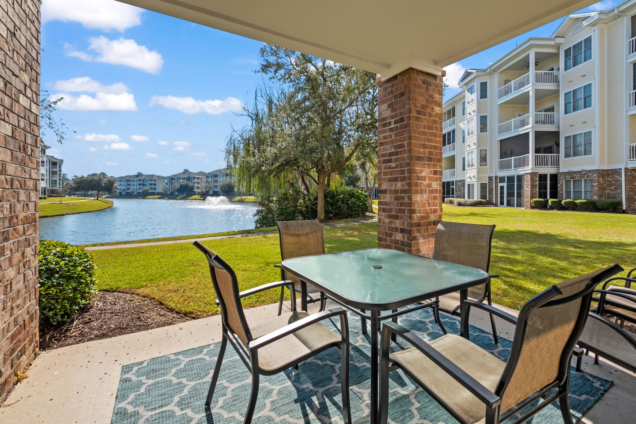 A stunning view of the lake, with comfortable outdoor seating—perfect for relaxing, enjoying the scenery, and soaking up the fresh air in a peaceful, natural setting.