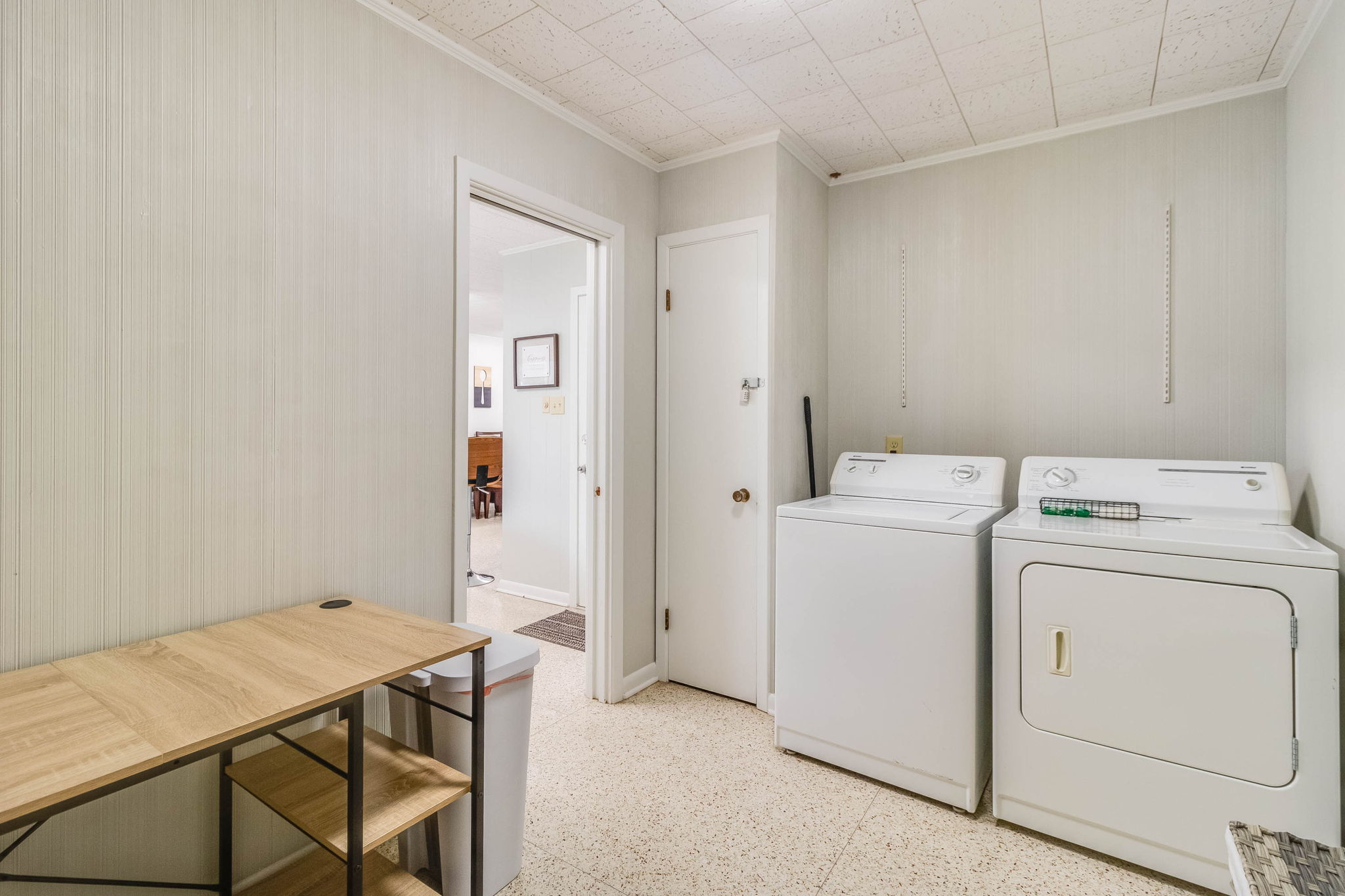 Laundry Room w/ Washer, Dryer, and Ironing Board