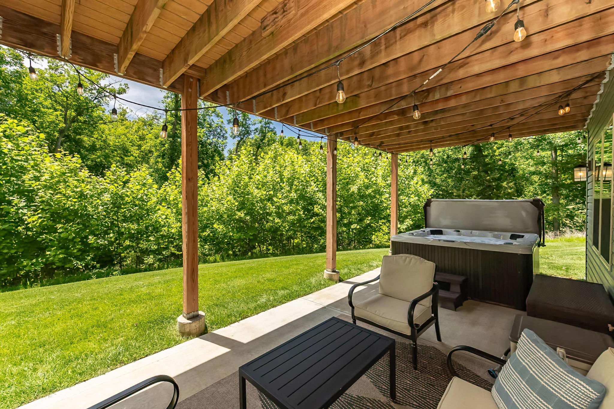 Comfortable outdoor seating makes the covered patio enjoyable year-round.