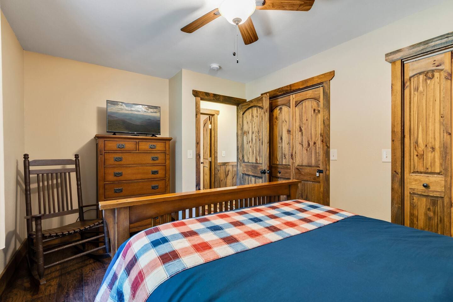 Queen-size bed, TV and Rocker in front bedroom