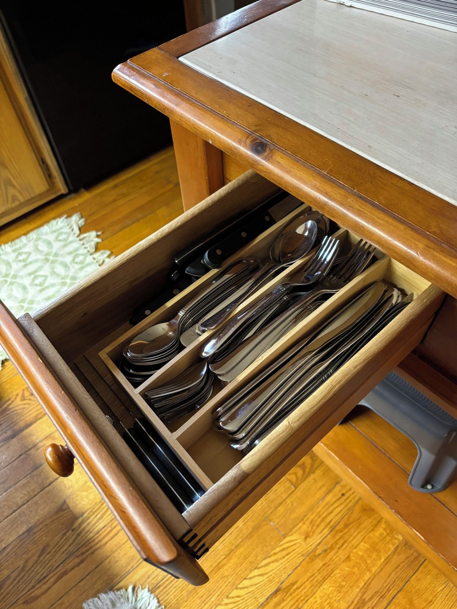 New silverware located in kitchen island. Enough for 8!