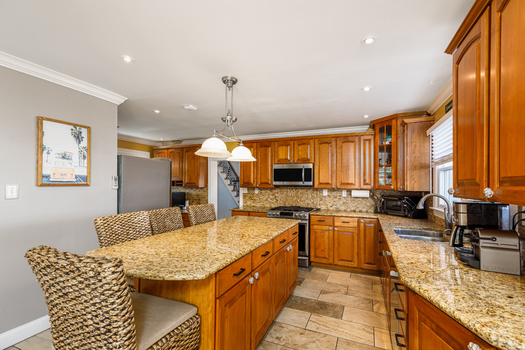 Serve breakfast at the large kitchen island in this fully equipped kitchen!