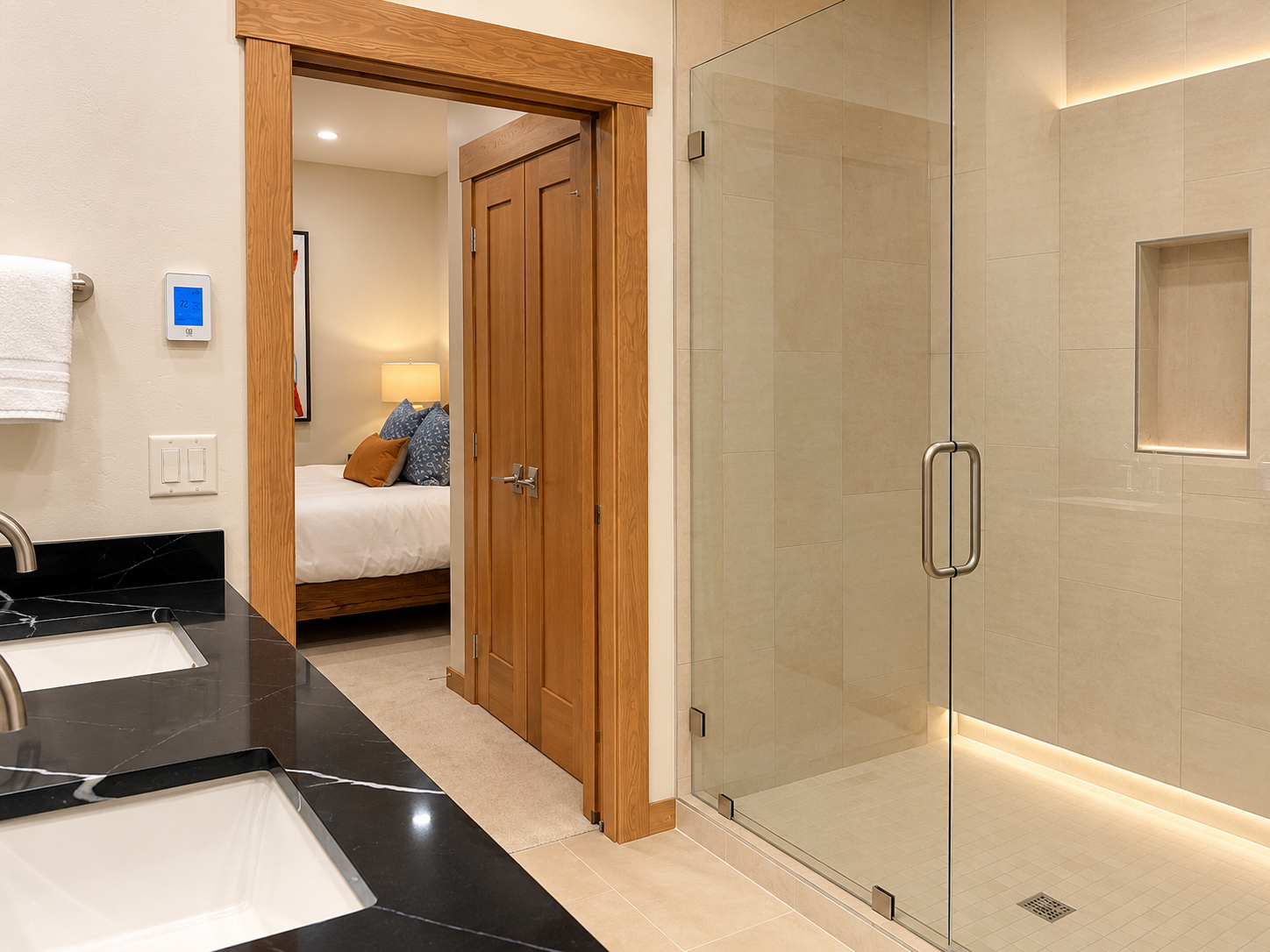 Spacious glass-enclosed walk-in shower.