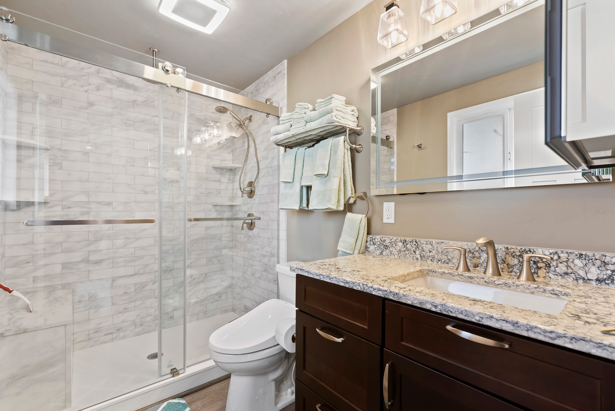 Enjoy the luxurious primary bathroom with a beautifully designed walk-in shower and a bidet, offering an elevated level of comfort and convenience.