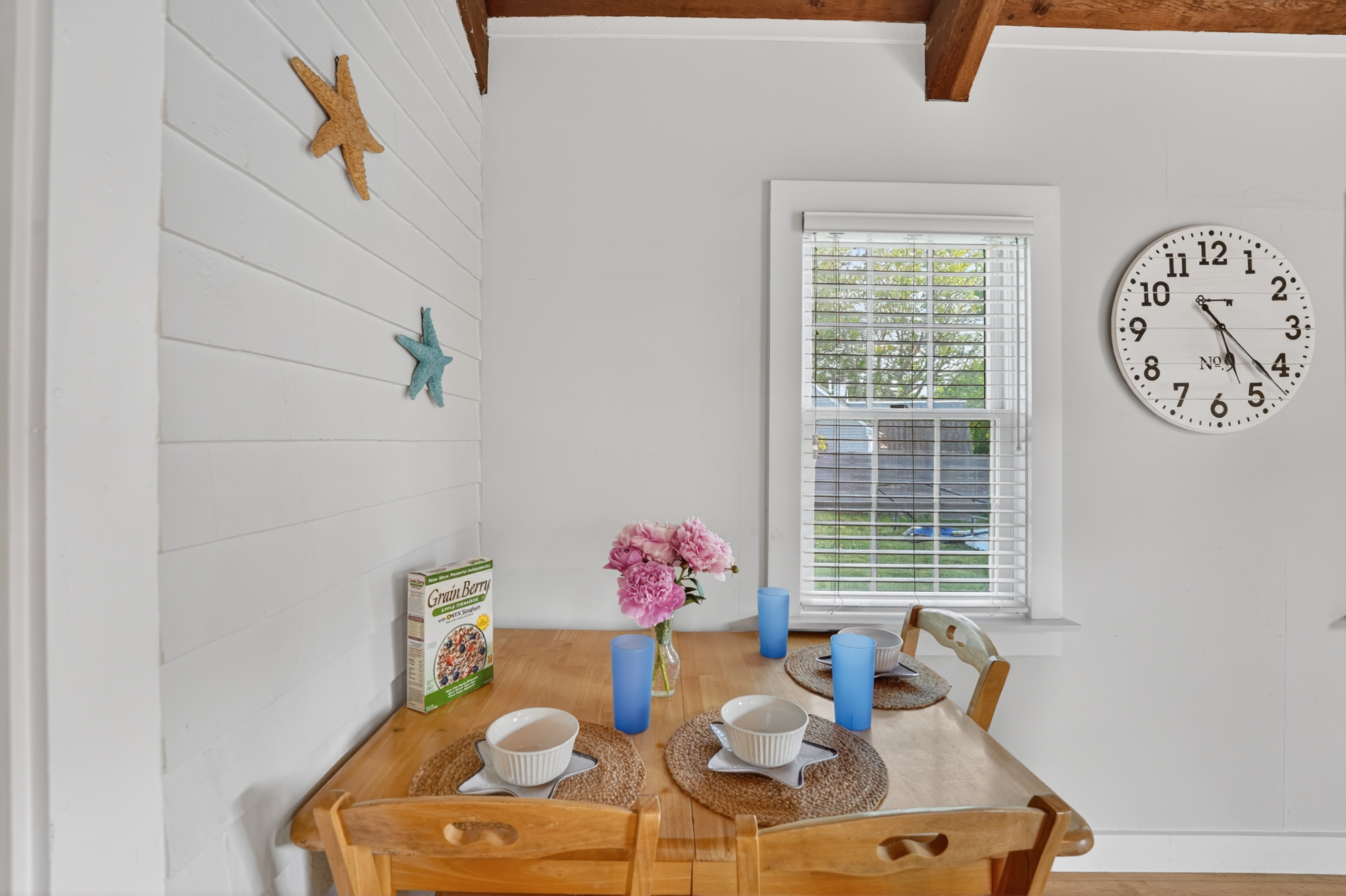 Cozy breakfast nook with seating for two, ideal for casual meals or planning the day's adventures.