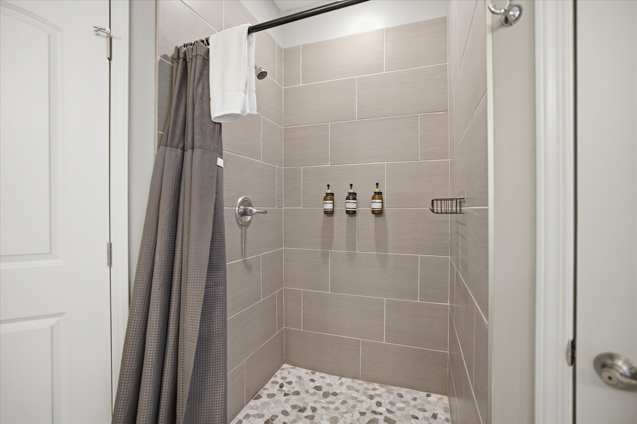 Turn on the shower, let the water run, and reset. After a full day, this space keeps things simple in the best way—quiet, comfortable, and ready when you are.