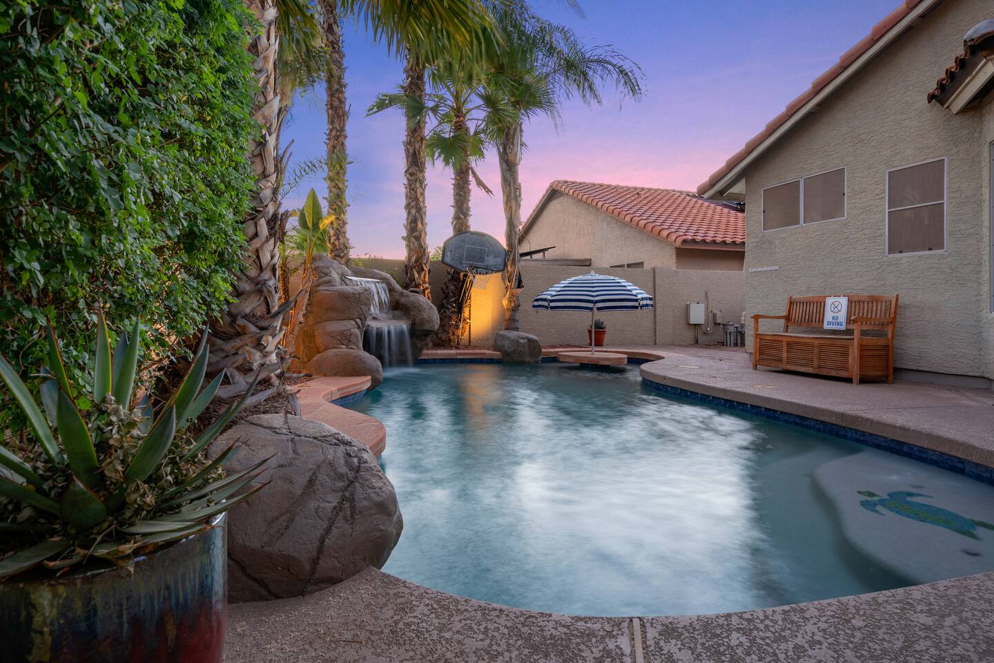A resort style luxury heated pool right in your own private backyard.Featuring a Grotto with waterfall, tiki bar, and pool basketball