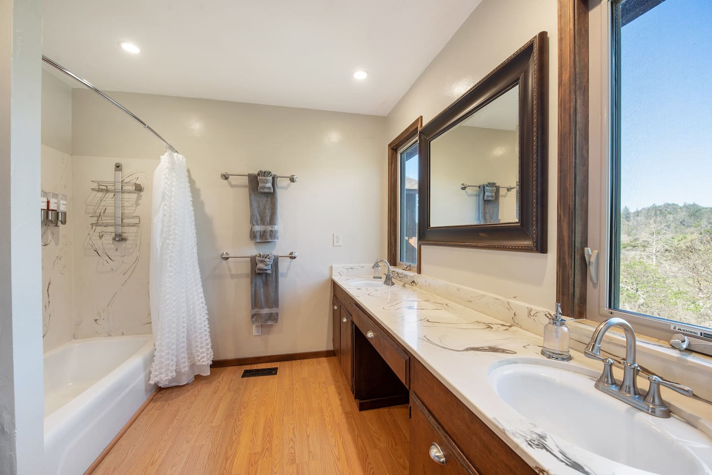 Primary En Suite Bathroom: two sinks and a bathtub