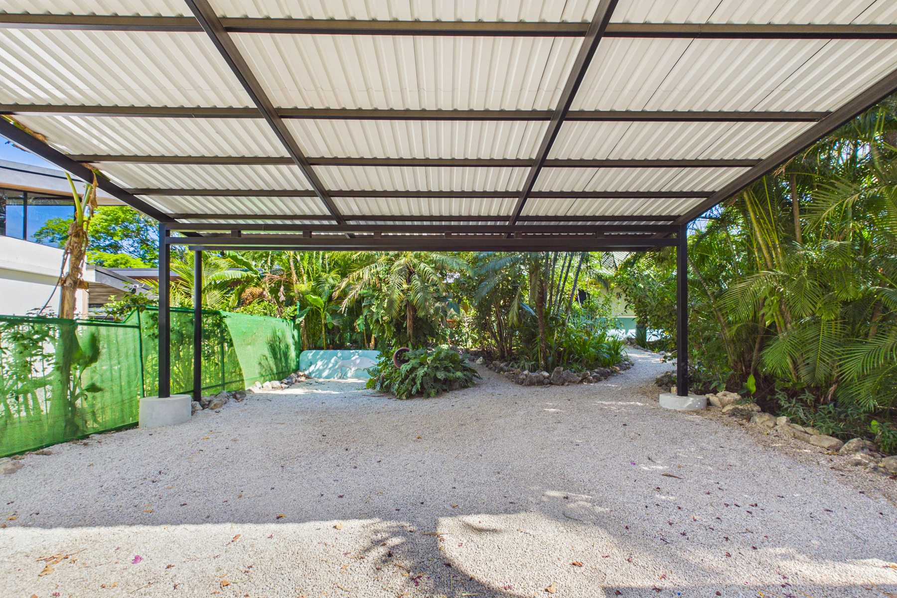 Covered Parking inside the electric gate for up to 2 cars plus a quad/Golf cart
