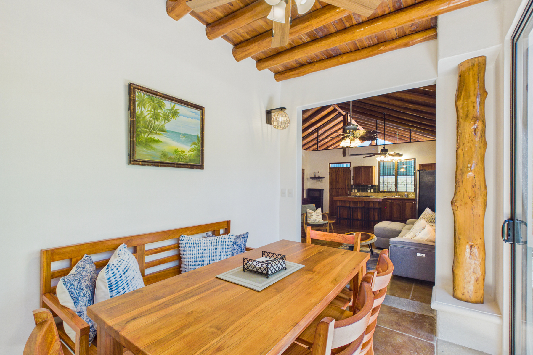 Indoor dining room opens to living room.  Indoor dining table offers seating for 6 plus additional dining seating indoor kitchen island