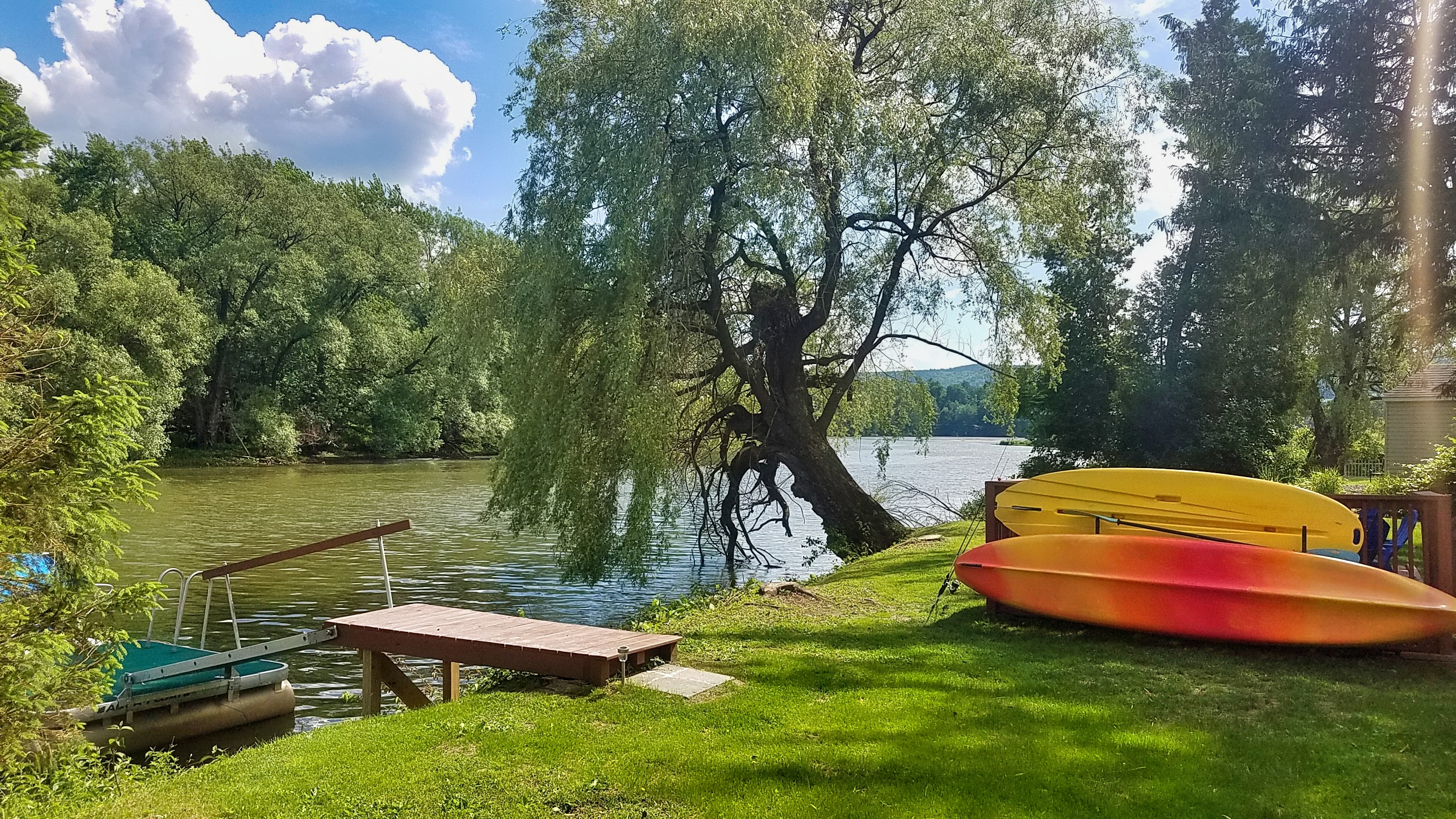 View of the water and dock. A tandem kayak and paddleboard on site for you!