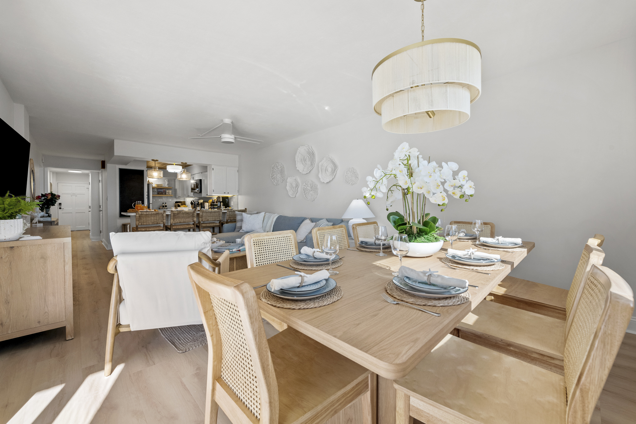 Dine, unwind, and recharge in this stylishly curated open-concept living space designed for coastal comfort.