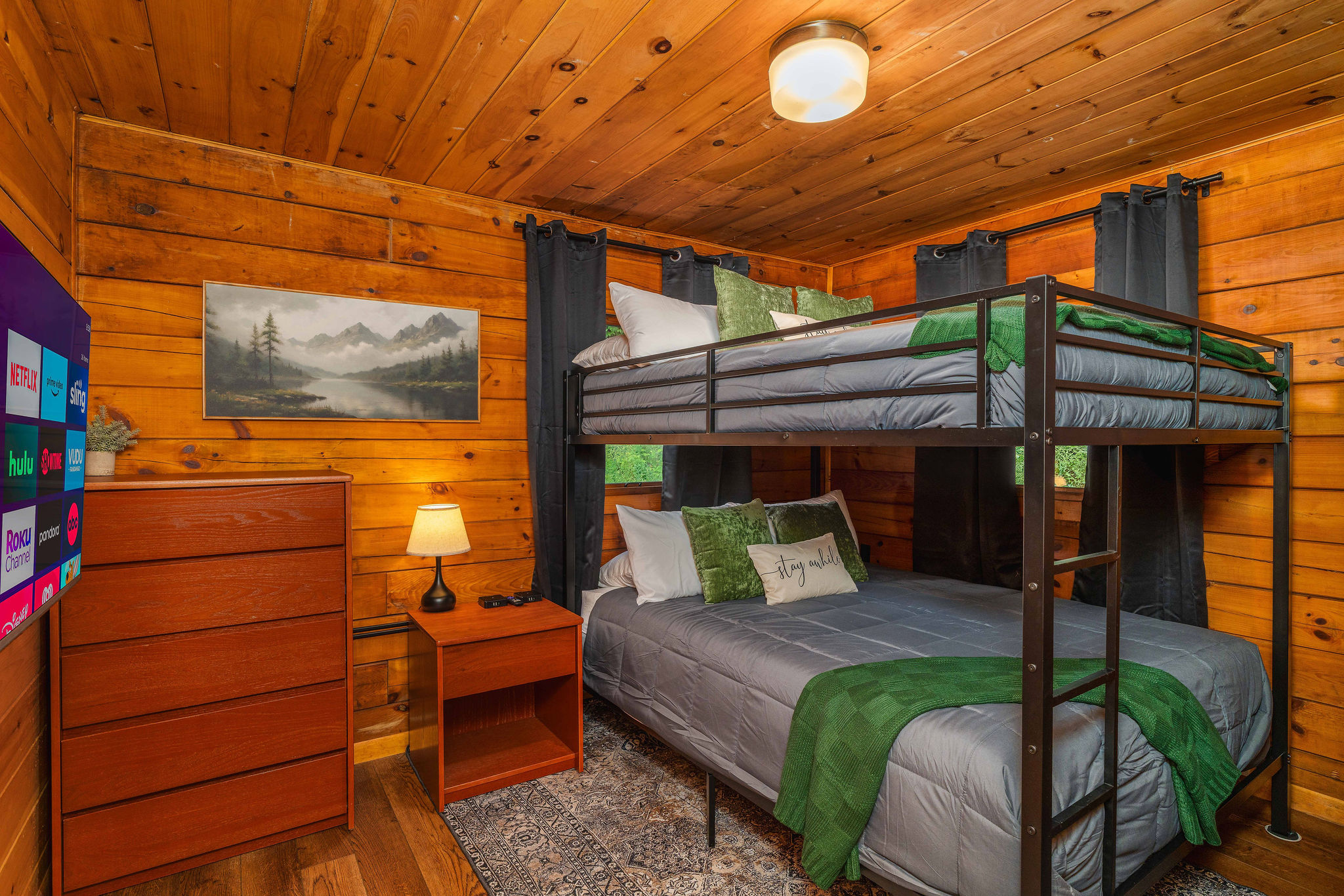 🛏 Guest room with a Queen-over-Queen bunk + 43" smart TV — sleeps 4 in real beds, not twins.