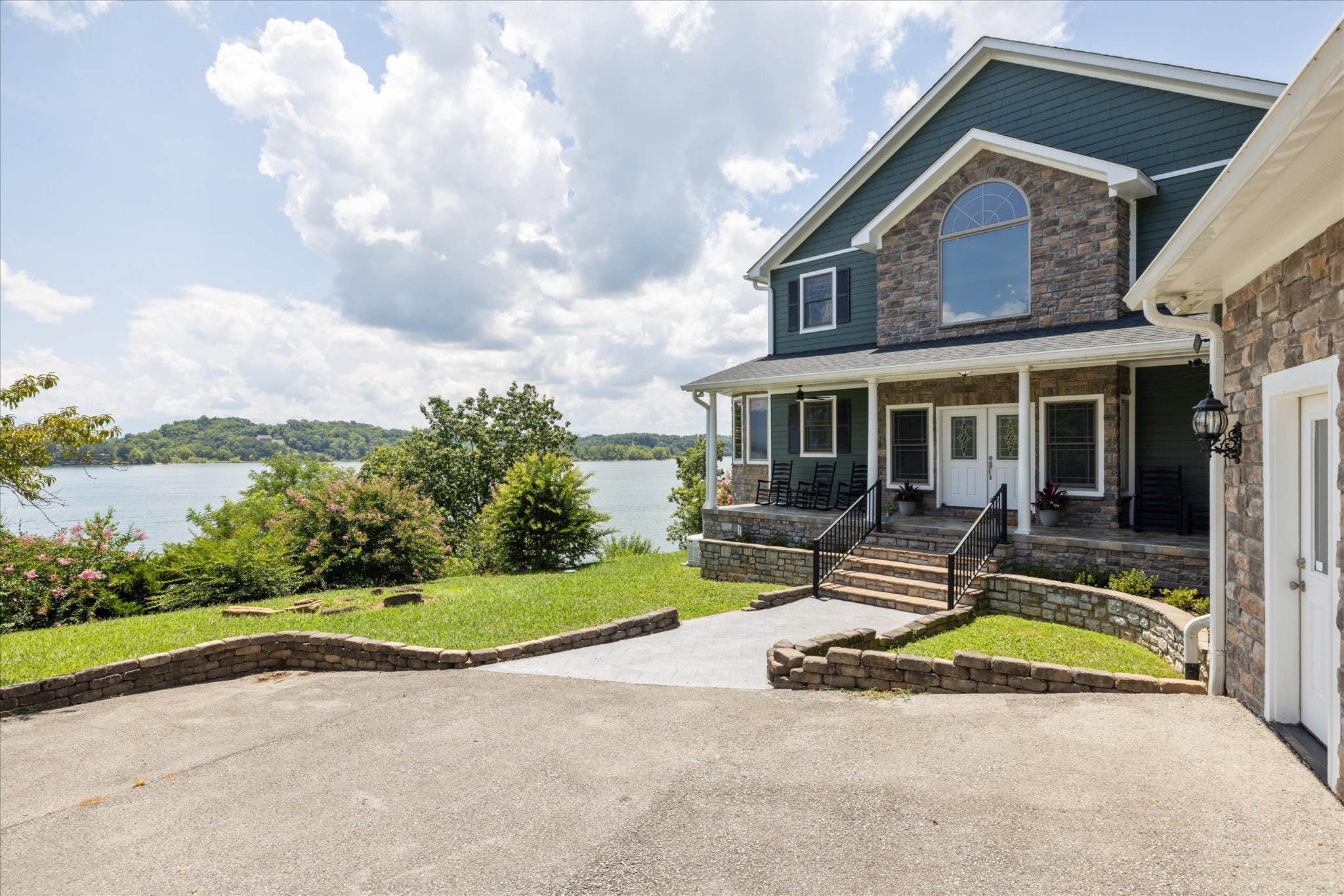 view of front porch and water from garage