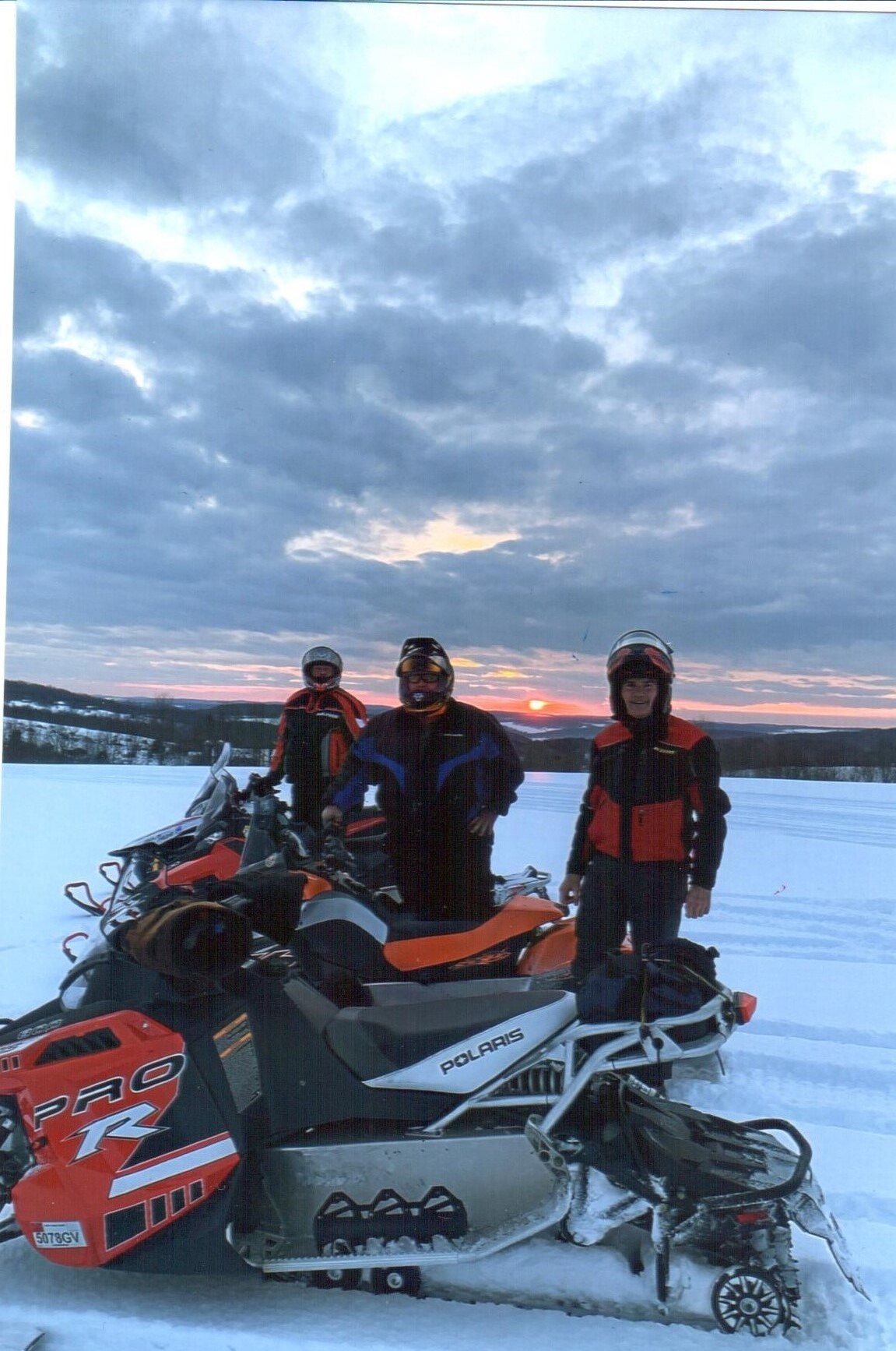 Snowmobile as sunset.