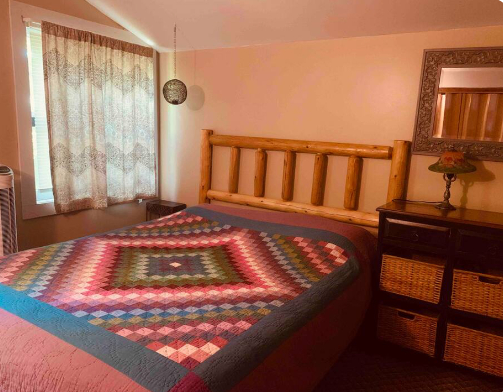 Cozy cabin queen bed.