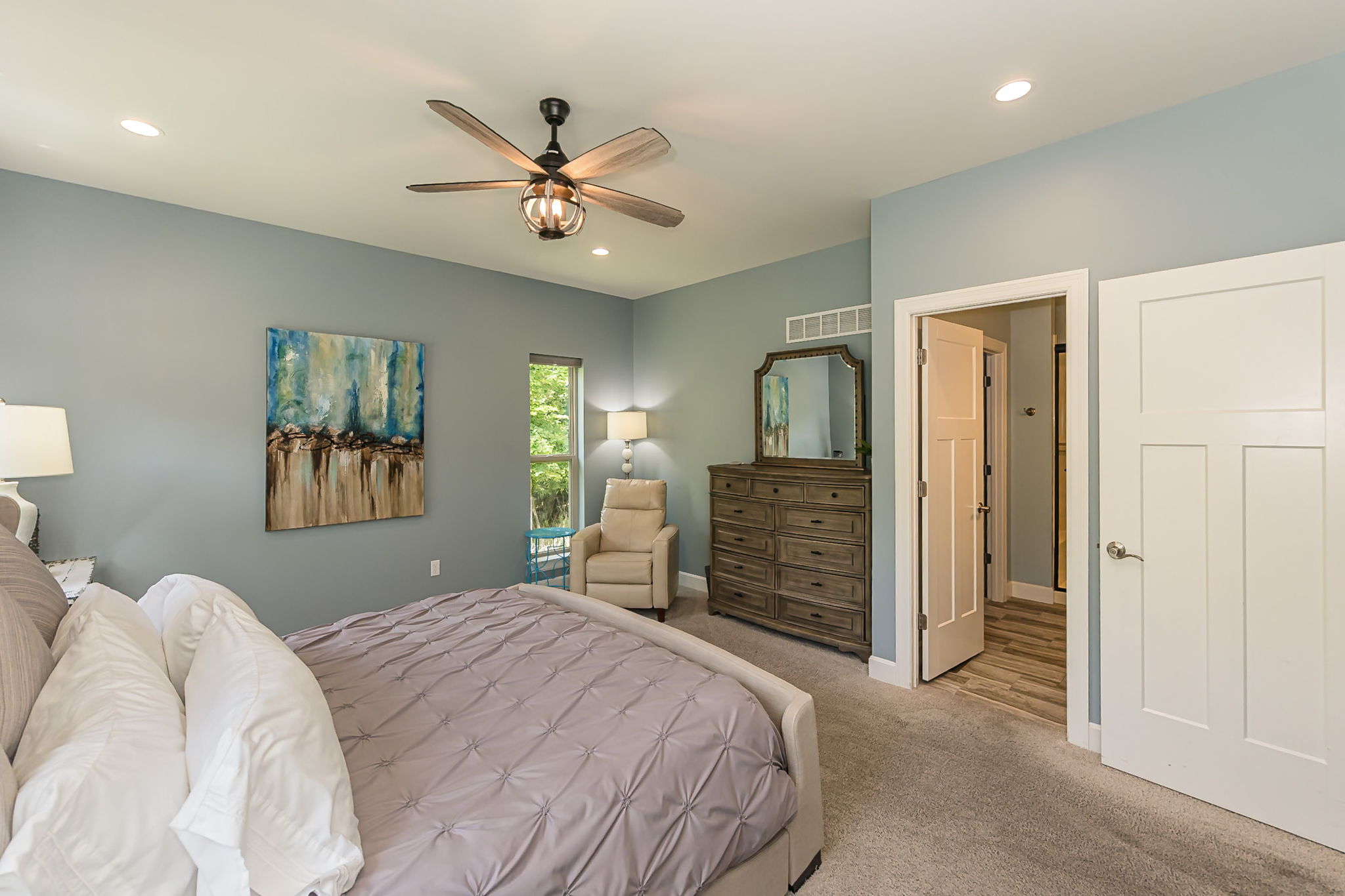 Spacious ensuite with comfortable seating, attached bathroom and walk-in closet.