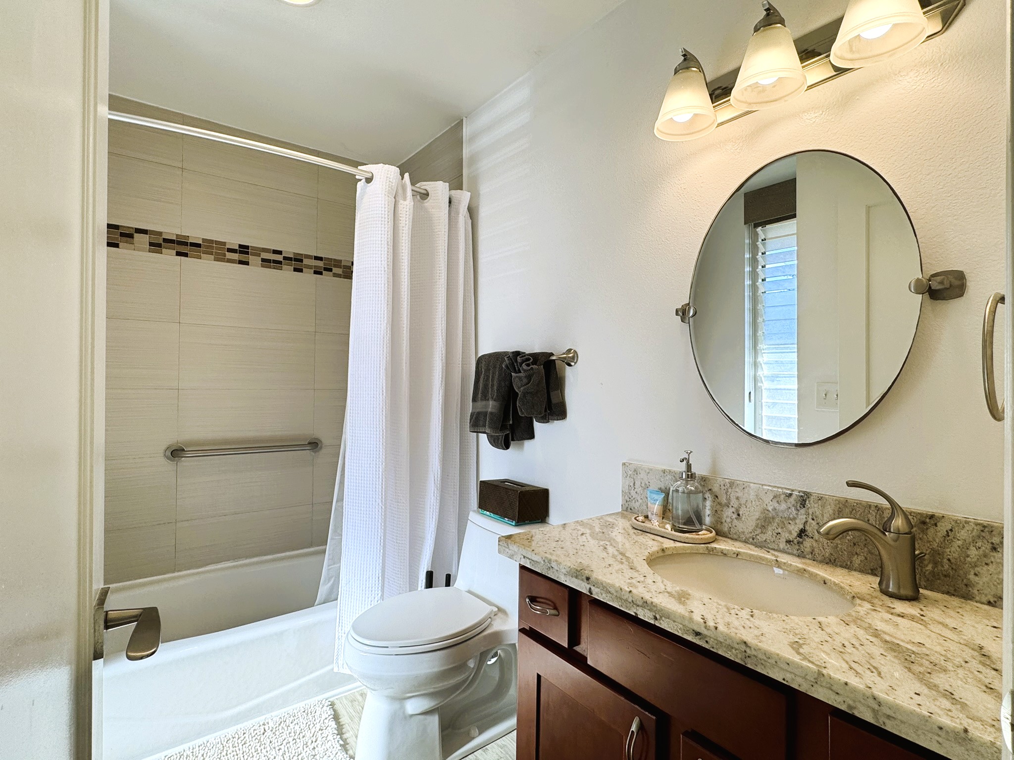 Full bathroom includes washer and dryer inside