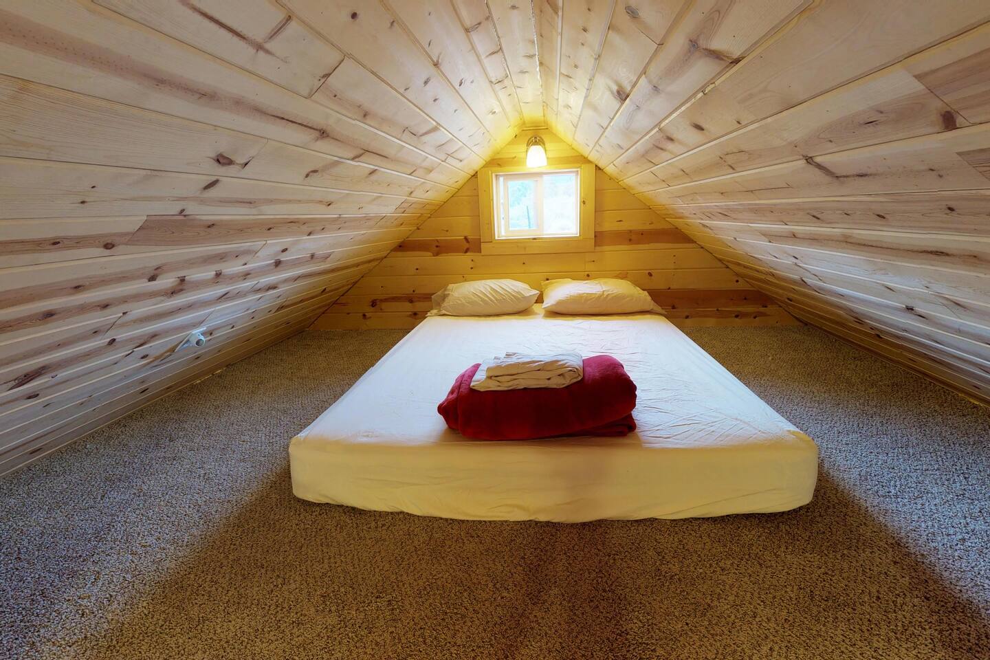 Queen sized bed in the loft.