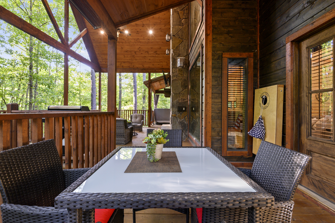 Dining table, lounge seating, hot tub and tv..what more could you need?