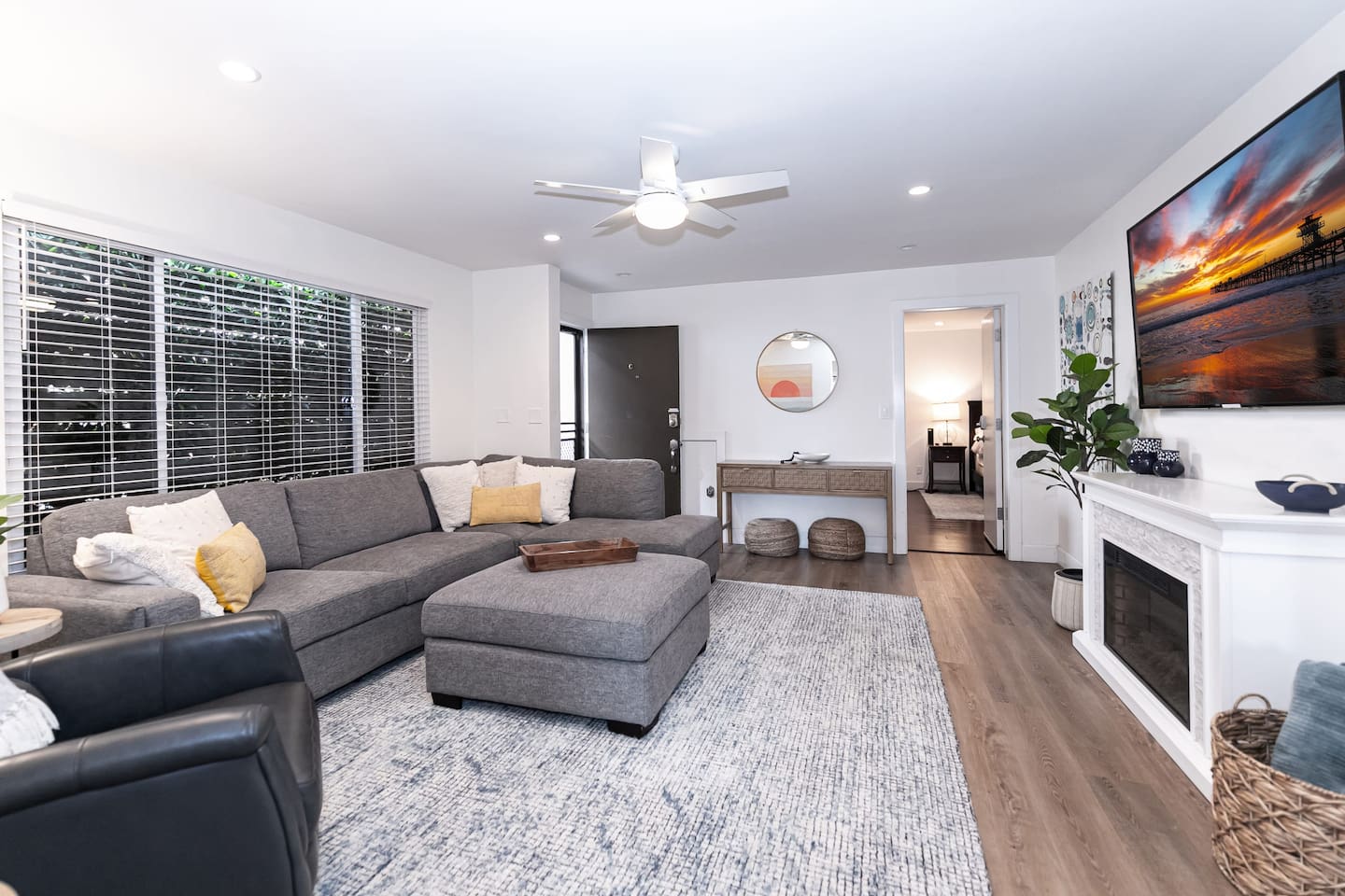 The living room also offers a fireplace and large-screen TV.