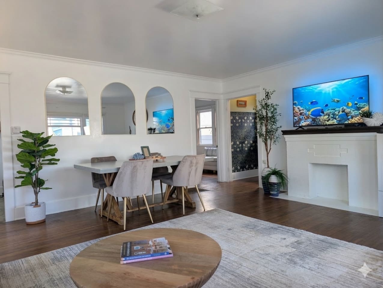 Open-concept living and dining area with TV, comfortable seating and spending time together.