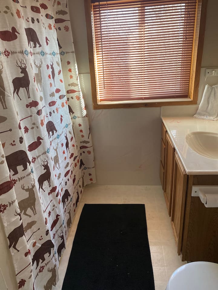 This full bathroom with tub and shower is on 2nd floor and has a  jetted tub.