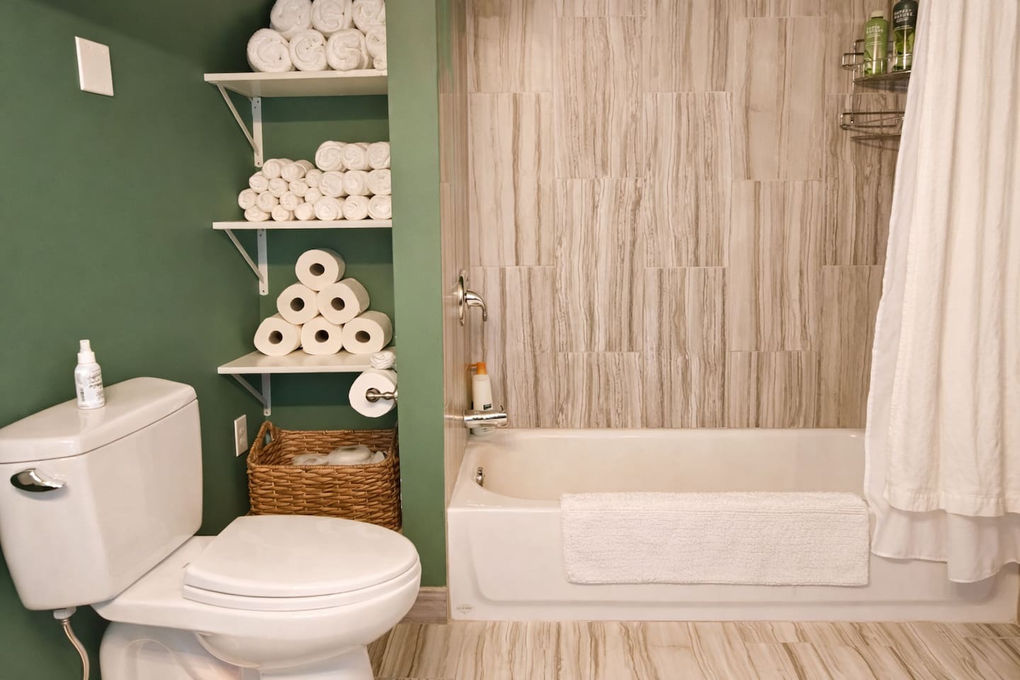 Clean modern bathroom with fresh towels and guest essentials.