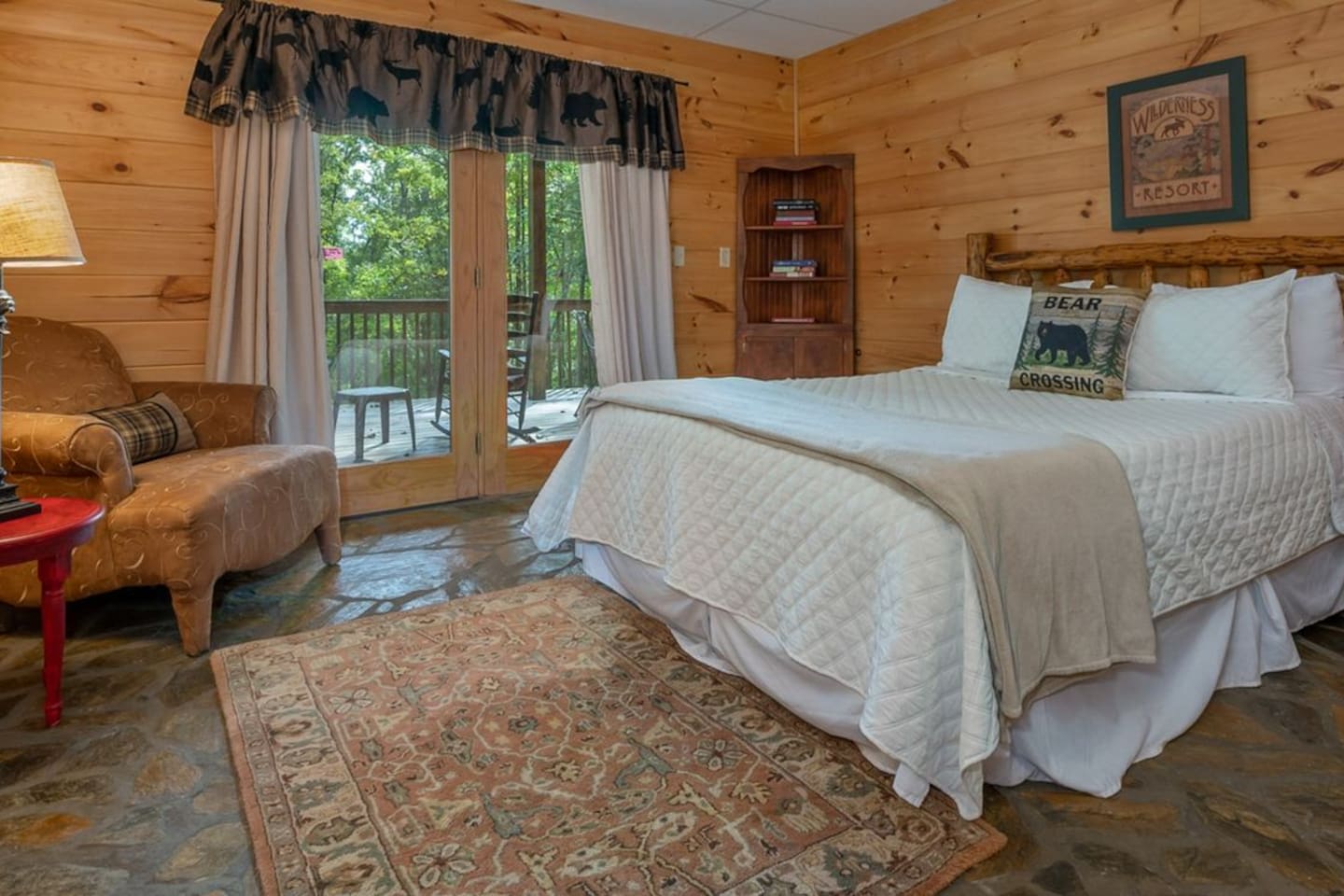 Master bedroom 3 on lower level - with full bath and French Doors to lower deck, with seating, overlooking back yard with lighted pavilion