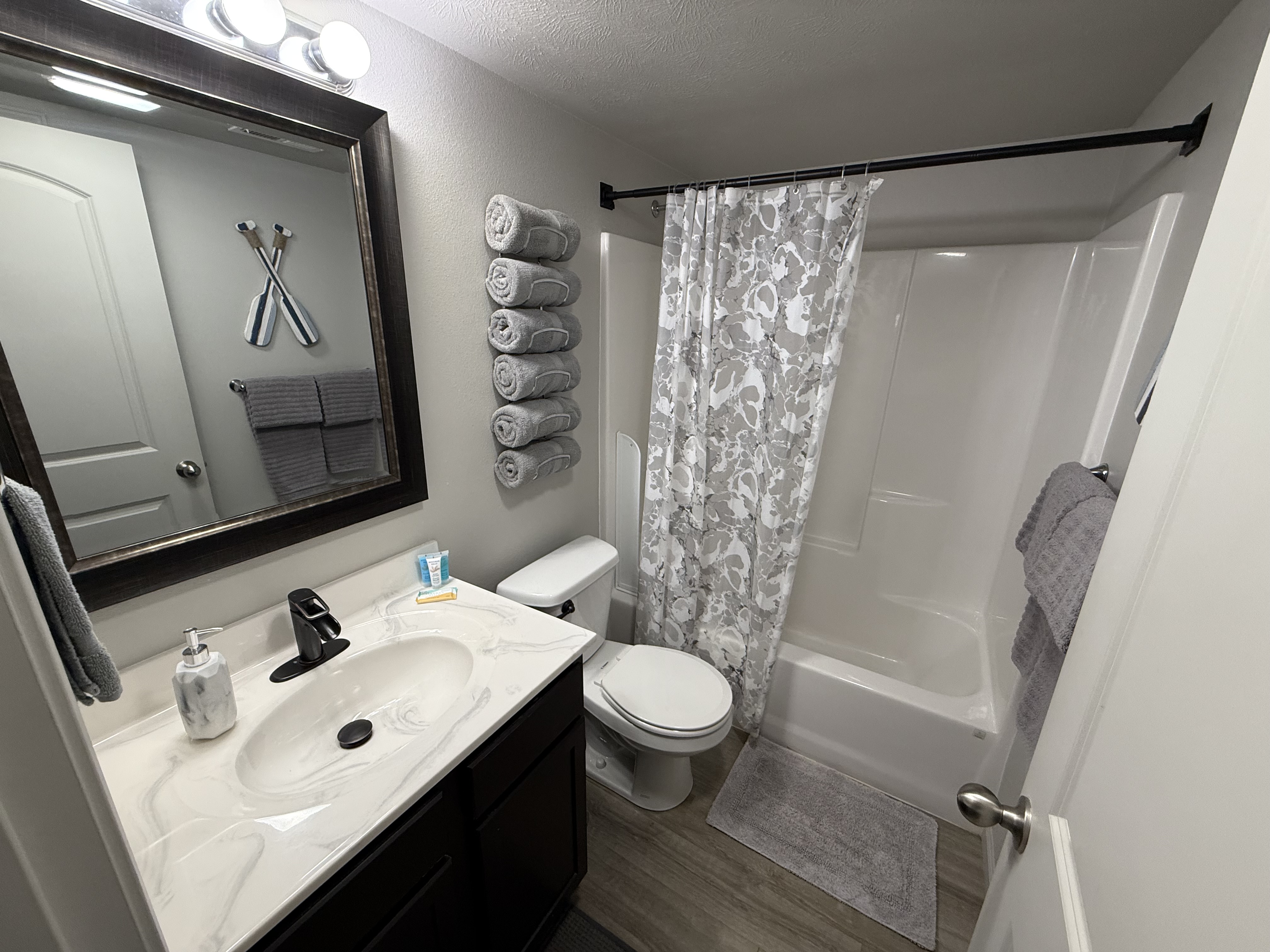 guest bathroom with closet behind door