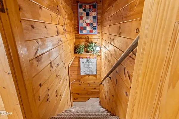 Basement Stairs to private play area and Second bedroom