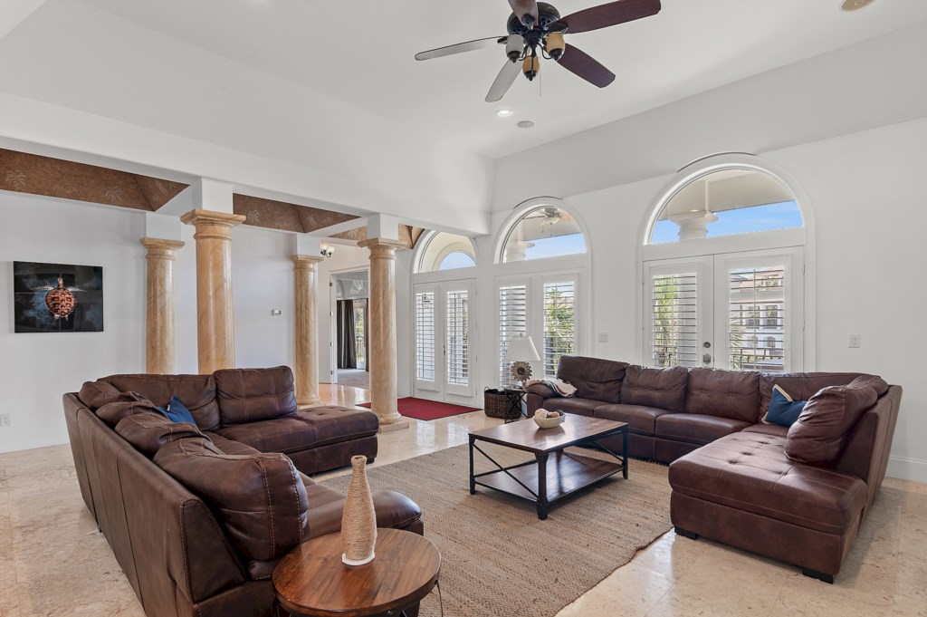 Spacious living area with high ceilings and abundant natural light
