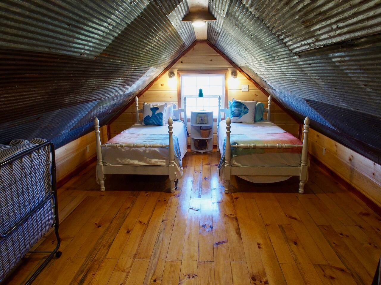 Open Air Loft Area Has Two Twin Beds and One Single Bed