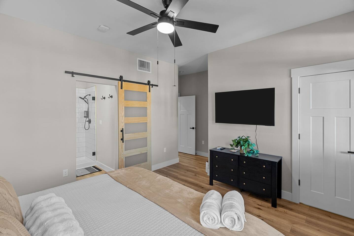 Master suite with King bed. Please note that shades are not room darkening and there are no curtains.
